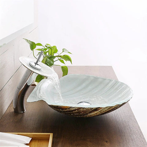 USZWBY Bathroom Vessel Sink Tempered Glass Bathroom Vessel Sink Shell Shape Above Counter with faucet and water flow.