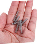 Get Your Hands On These 100 Pc Mini Stainless Steel Compression Springs, A Total Badass Kit For DIY Mechanics And Home Repairs That Makes Fixing Doors Cars And Metal Gadgets Super Easy And Quick. mini silver springs in hand