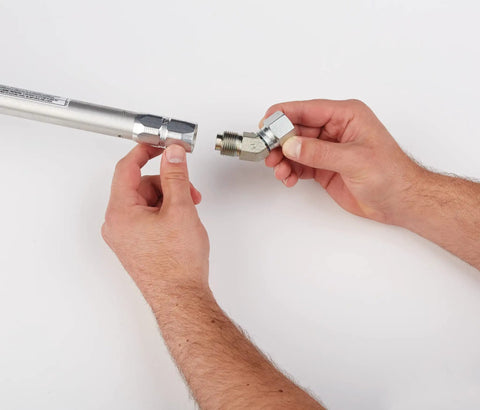 Hands attaching adapter to Pressure Roller Kit For Airless Spray Guns No Tool Attachment With EvenFlow Drip Free Paint Delivery.