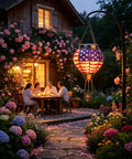 Solar Hot Air Balloon Lantern With Flickering Flame, Glass Outdoor Hanging Lantern illuminating a garden with people dining al fresco
