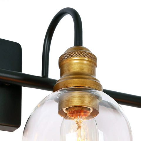 Close-up of 4 Light Modern Farmhouse Vanity Light Fixture in Black with Oil Rubbed Bronze Finish and Clear Globe Glass Shades.