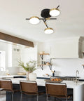 Image of 3 Light Dimmable LED Semi Flush Mount Ceiling Light Fixture in Modern Gold and Black in a bright kitchen setting