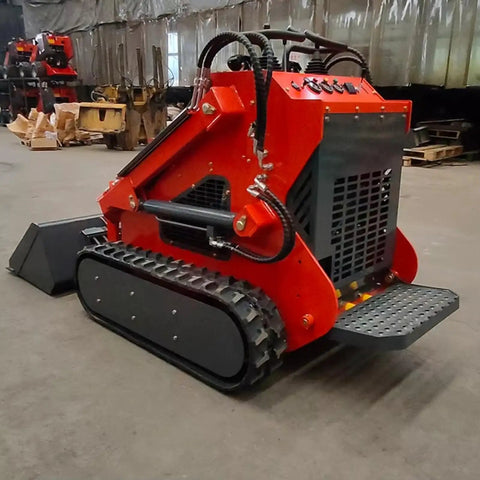 Front view of Compact Track Loader Skid Steer with Enclosed Cab and High Flow Hydraulics, shown on concrete floor in warehouse.
