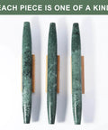 Top view of French Marble Rolling Pin With Wooden Resting Base 15 Inch Nonstick Dough Roller For Pie Crust Cookies And Pasta Delivers Smooth Even Rolling And A Sleek Countertop Vibe For Every Home Baker, featuring green marble and wooden base on white background.
