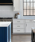 White kitchen with Black Cabinet Pulls Six And One Quarter Inch Hole Spacing Wide Base Kitchen Cabinet Handles on drawers and cabinets