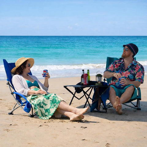 Couple relaxing on beach with High Back Beach Chair For Camping And Tailgating, Ultra Lightweight Yet Heavy Duty Support, green chairs.