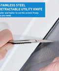 Person using stainless steel retractable utility knife from DIY Five In One Window Screen Repair Kit to cut screen material.