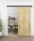 Installed Six Foot Barn Door Hardware Kit Black Aluminum Box Rail Sliding Track with wooden door in modern interior.