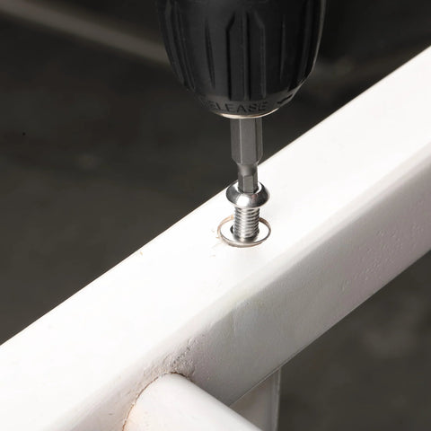 Drill inserting stainless steel screw into white surface from Stainless Steel Fastener Kit With 810 Pieces Nuts Bolts And Washers For DIY Projects M3 M4 M5 M6 Button Head Socket Cap Screws Assorted Hex Bolts Nuts And Washers For Home Auto And Outdoor Use Built To Last Durable Rust Resistant Hardware Set