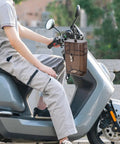 Heavy Duty Outdoor EV Charger Socket Case Weatherproof Plug Protector Built Tough mounted on an electric cycle with a person.