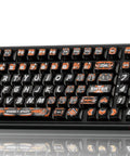Your Legit Top Shelf 98 Key Gasket Mount Mechanical Keyboard With Numpad And Volume Knob featuring black keys with orange accents.