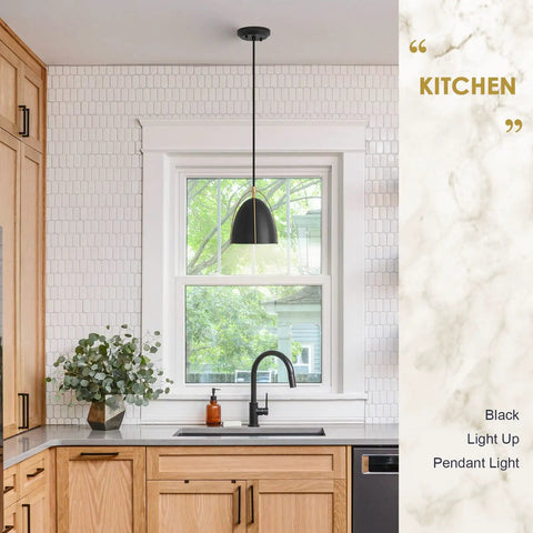 Dope Black Dome Pendant Light With Gold Trim For Kitchen Island And Dining Room hanging over kitchen sink.