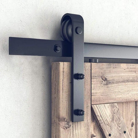 Hella Sturdy 7.5ft Sliding Barn Door Hardware Kit Smooth Gliding Track System For Single Doors No Fuss Heavy Duty Installation Matte Black Carbon Steel close-up of roller and track.
