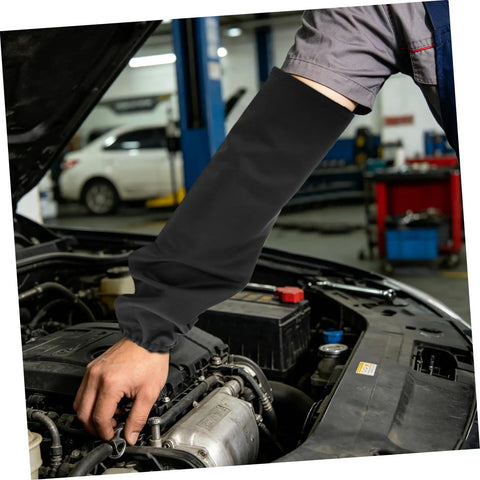 Legit Flame Resistant Welding Sleeves And Built Different Cotton Arm Guards offering heat protection while working under a car hood.