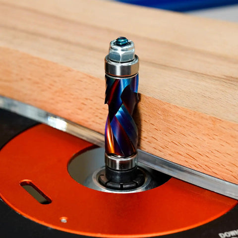 Coated Flush Trim Router Bit With 1/4 Inch Shank, 1/2 Inch Cutting Diameter, 1 Inch Cutting Length, installed in router with wood