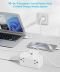 Top Shelf Universal Travel Plug Adapter With Six Ac Outlets And Four Usb Ports Including Two Usbc Fast Chargers And A Neatly Wrapped Three Foot Cord For Easy Packing And No Stress Global Travel on a table with a laptop and phone.