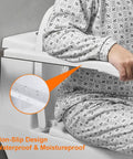 Person using 27.5 Inch Stainless Steel Bathroom Grab Bar With Foldable Skid Resistant Toilet Safety Rail For Disabled And Seniors Plus Seat Support Durable Handicap Bath Accessory