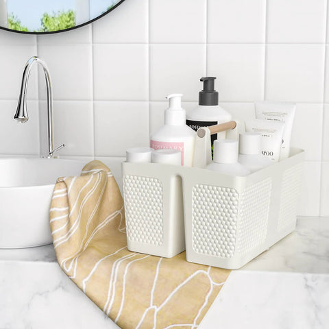 Portable Shower Caddy With Handle For Bathroom And Kitchen, Rust Resistant Durable Organizer With 3 Large Compartments in milky white on a bathroom counter