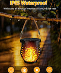 Four Pack Solar Lanterns With Flickering Flame, Outdoor Waterproof Hanging Lights with realistic orange flame effect in rain.