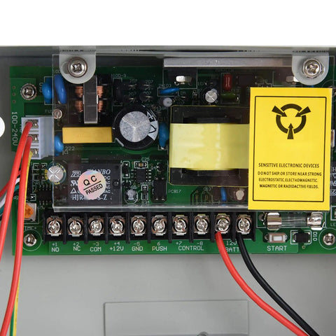 Internal circuit board of Heavy Duty Access Control Power Supply Box 110 to 240VAC Input 12VDC Output Switching Supply for Door Access System UPS 5A Max Current External Connection Interface Battery Anti Polarity and Overdischarge Protection with wiring connections visible.