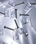 20 Piece Heavy Lifter Plastic Mirror Mounting Clips Kit With Premium Stainless Screws scattered on a reflective surface.