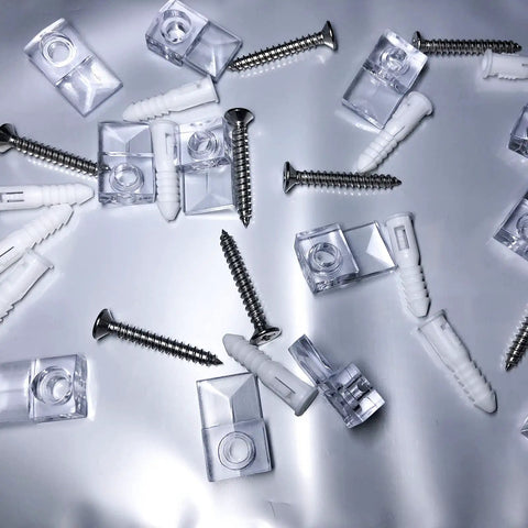 20 Piece Heavy Lifter Plastic Mirror Mounting Clips Kit With Premium Stainless Screws scattered on a reflective surface.