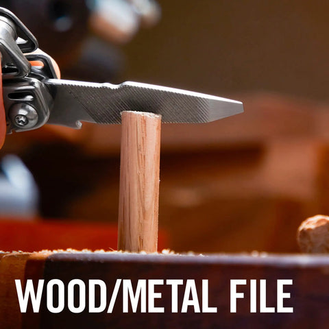 Close-up of Wingman Multitool With Spring Action Pliers And Scissors Stainless Steel 14 Tools In One filing wood