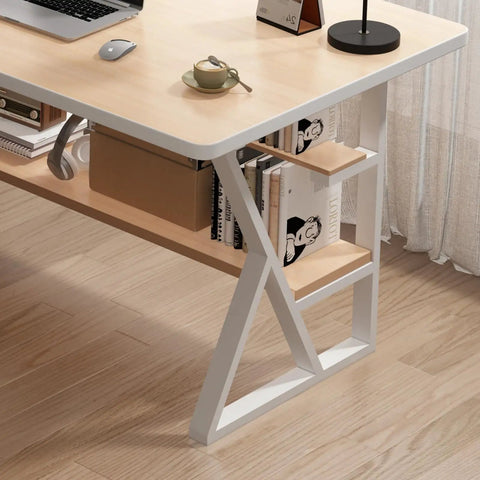 Modern desk with white metal legs and wooden tabletop, featuring a bookshelf with books and a lamp, in a home office setting.