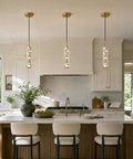 Modern Cement Pendant Lights, Hanging Lamp for Kitchen Island,6000K,2 Pack above a kitchen island with elegant gold accents.