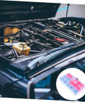 Zerk Fitting 100Pcs Assortment Kit With Straight And Grease Nipples alongside an open car engine for maintenance use.