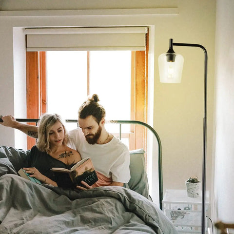 Couple reading next to Industrial Black Floor Lamp For Living Room And Bedroom With Champagne Glass Shade Tall Farmhouse Style Standing Lamp