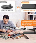 Man using 8X Real Glass Magnifying Glass With Light And Stand 2 In 1 Desk Lamp And Clamp for electronics repair on desk
