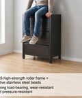 Hella Durable Self Adhesive Caster Wheels One Inch Swivel Plates with a person sitting on a drawer unit, highlighting stability and strength.
