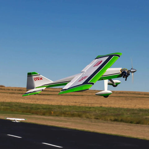 Ultra Stick 30cc ARF RC Airplane For Hobbyists With Multicolor Finish flying outdoors, side view, blue sky background, HAN2365 Today.