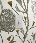 Jumbo Floral Neutral Vinyl Wallpaper With Dope Leather Texture Pattern Type Two showcasing floral design near a light switch.