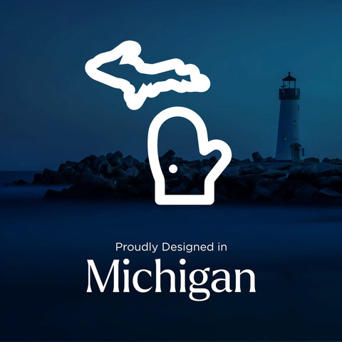 Silhouette of Michigan map and mitten with lighthouse background, text proudly designed in Michigan.