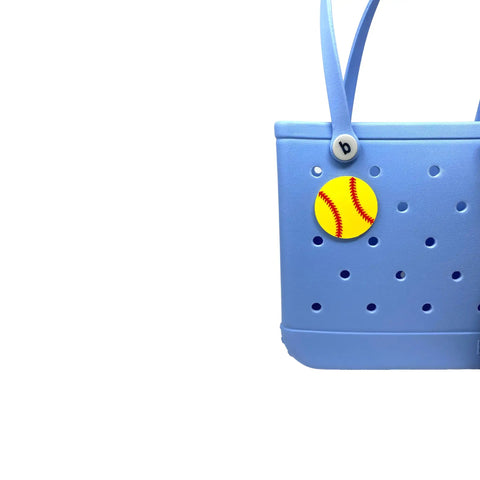 Softball Ball Tote Bag Charm With Team Spirit on a blue tote, durable decorative accessory for Bogg Bags, made in USA, easy clip-on.