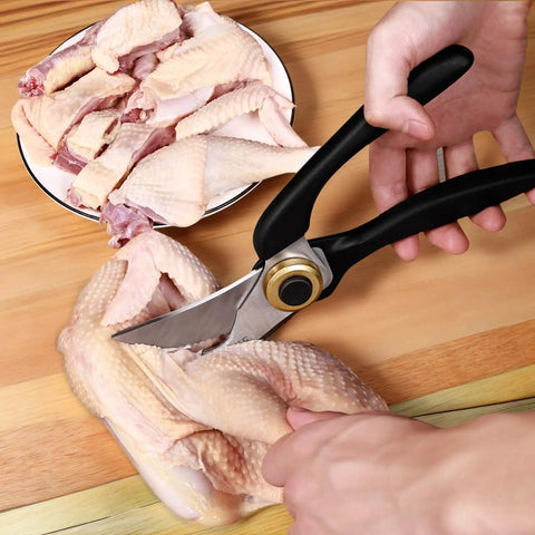 Heavy Duty Kitchen Scissors With Non Slip Handle And Auto Unlock For Cutting Meat Poultry Roasts Turkey And Fish Serrated Stainless Steel Blades With Ergonomic Grip Tough Yet Easy To Use Everyday Kitchen Tool shown cutting raw chicken