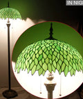 Green Stained Glass Lampshade Replacement, 16 Inch Wide by 7 Inch High, Vintage Wisteria Pattern on floor lamp at night