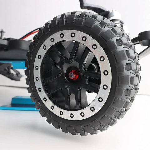 Tune Up Your Ride With These 8 Fresh Red M4 Flange Lock Nuts Built For 1 10 Scale Rc Cars Featuring Serrated Nylon Inserts And Lightweight Aluminum Wheels Upgraded Replacement Hardware. Close-up of black RC car wheel with serrated flange and red nut.