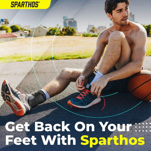 Man wearing Lace Up Ankle Brace With Adjustable Support For Running And Court Sports Like Basketball And Volleyball Go-To Injury Recovery Gear For Sprains And Stability, Compression Stabilizer Ankle Brace For Men And Women Gray Large, sitting on a basketball court