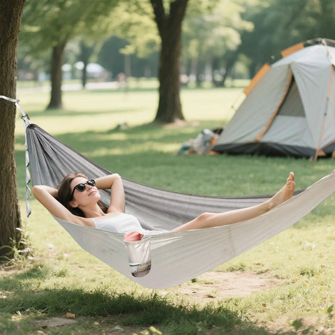 Woman relaxing outdoors in Vintage Bathtub Camping Hammock, Ultra Lightweight And Portable, Heavy Duty 330 Lb Capacity
