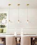 Premium White Scalloped Ceramic Pendant Light Adding Sweet Vintage Charm To Kitchen Islands with gold fittings above a dining table.