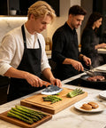 Man using Heavy Duty Kitchen Meat Cleaver Set With Carbon Steel Blade And Leather Sheath for chopping asparagus