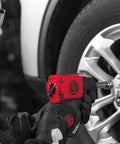 Mechanic using One Half Inch Air Impact Wrench With Two Inch Extension Anvil Twin Hammer Pistol Grip Industrial Repair And Assembly Tool In Durable Pistol Handle Design 715 Foot Pounds Of Torque And 970 Nm At Ten Thousand RPM on car tire
