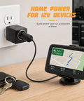 Pretty Slick AC To DC Car Adapter Turns Home Outlet Into 12V Cigarette Lighter Jack With Glowing LED Beacon on wall outlet with GPS device.