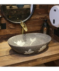 Built Tough 22 X 14 Oval Ceramic Vessel Sink Delivering Chinese Antique Charm And Easy Peasy Cleanup For Any Bathroom Or Balcony Countertop Remodel And Upgrade, displayed in earthy tones on a wooden countertop.