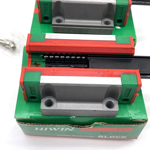 Close-up of Quad Load Linear Guide Kit HGH20CA HGH20HA HGW20CC HGW20HC HGR20 showing carriage bearings and green packaging.