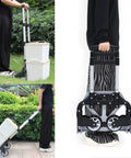 Folding telescoping hand truck carrying boxes outdoors