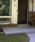 Turbo Wet Look Concrete Sealer Spray delivers high gloss finish on concrete porch at residential entrance.